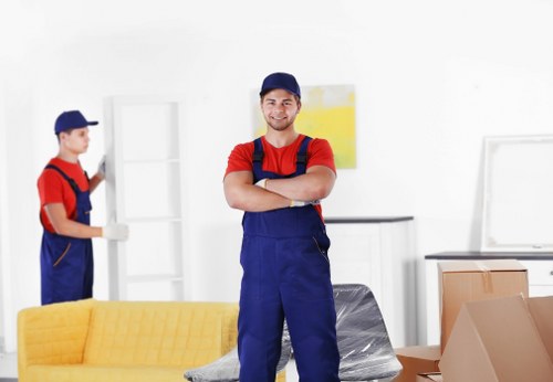 Professional packing team preparing boxes in Docklands apartment