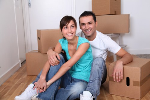 Professional man and van in Docklands handling a home move with furniture
